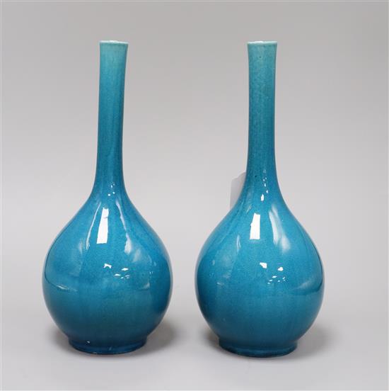 A pair of Japanese turquoise glazed bottle vases height 29cm